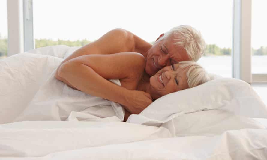 Mature Couple Cuddling In Bed