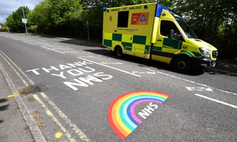 An ambulance driving past Thank You NHS road markings outside Dorset county hospital in Dorchester on Saturday.