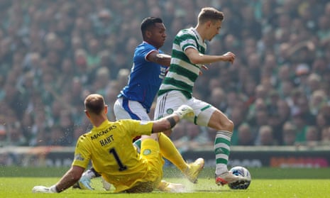 Alfredo Morelos is thwarted by the challenge of Celtic’s Carl Starfelt as the Rangers player goes past Celtic keeper Joe Hart.