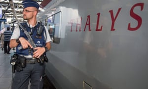 A police officer patrolling at Brussels Midi station.