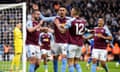 Aston Villa players celebrate their side's first goal of the game against Chelsea.