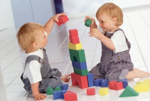 Twins playing with blocks