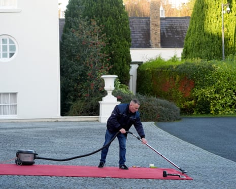 Final preparations to the red carpet which has been rolled out ahead of the arrival of Ukrainian President Volodymyr Zelenskyy at Aras an Uachtarain in Dublin.
