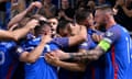 Slovakia’s players engulf David Hancko after his first-minute opener against Liechtenstein