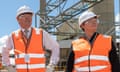 Anthony Albanese and Madeleine King  in hard hats and high vis vests