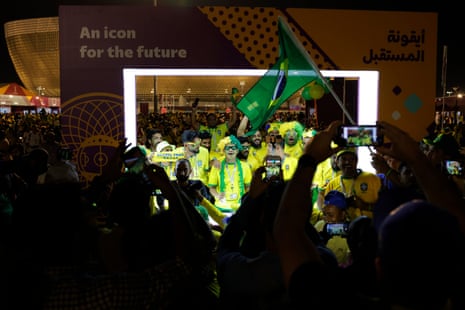 Brazil fans have pictures taken in the posing frame outside Lusail Iconic Stadium.