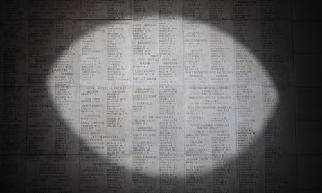 A pool of light illuminates the engraved names of the missing at the Menin Gate Memorial in Ypres, Belgium