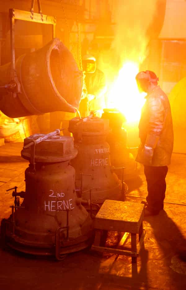 A worker at The Whitechapel Bell Foundry casting bells for the parish of Herne in Kent in 2011.