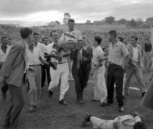 The USA centre-forward Joe Gaetjens is carried off by cheering fans after his team beat England 1-0 in Belo Horizonte