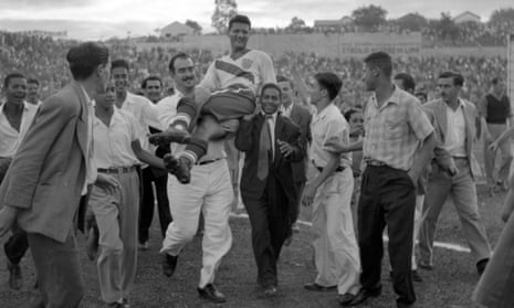 US centre-forward Joe Gaetjens is carried off by cheering fans after his goal beat England at the 1950 World Cup