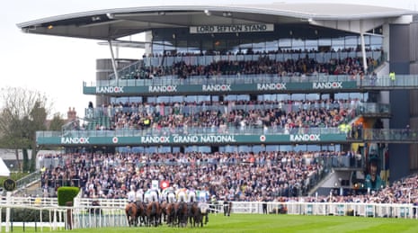 A general view of the runners and racers during the William Hill Handicap Hurdle on Grand National day.