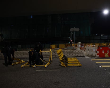 Police setting up a fence with heavy barricades around courts building early on Monday