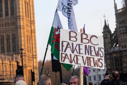 Protesters with a sign reading 'BBC fake news' in Westminster, London, May 2019