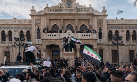 Large crowds occupy the train station as the funeral cortege for Mazen al-Hamada passes al-Hijaz square