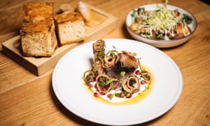 At Brigade: Dartmoor lamb chops. Back left: beef dripping focaccia. Back right: Confit pork shoulder.