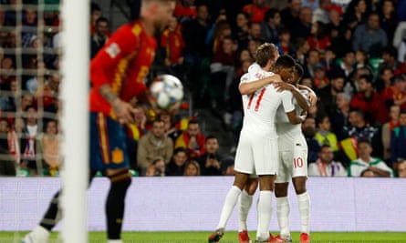 Marcus Rashford celebrates after scoring England’s second in Seville with Raheem Sterling, right, and Hary Kane.