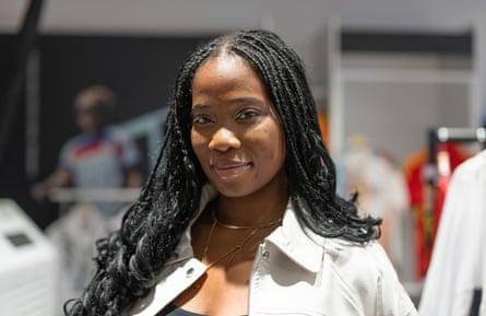 Simi Akintelure, 18, browses sports gear at the shop in central London.