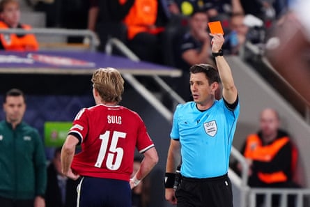 Pavel Sulc is shown a red card by Halil Meler for a foul on Elliot Anderson.
