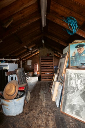 In the loft, pictures and posters are stacked high, stored with the tools for maintaining Prospect