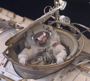 Astronaut Andrew Feustel reenters the space station after completing an eight-hour spacewalk in 2011.<br>