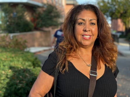 A woman smiles and poses