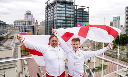 Weightlifter Emily Campbell and diver Jack Laugher wave England flags