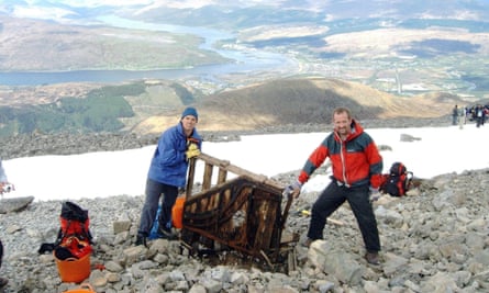 Undated photo issued by the John Muir Trust of Paul Nelson and Andrew Hunter with a piano that they found on Ben Nevis.