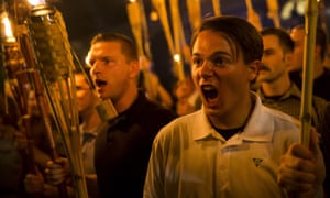 White supremacists march with torches in Charlottesville, Virginia on 11 August 2017.
