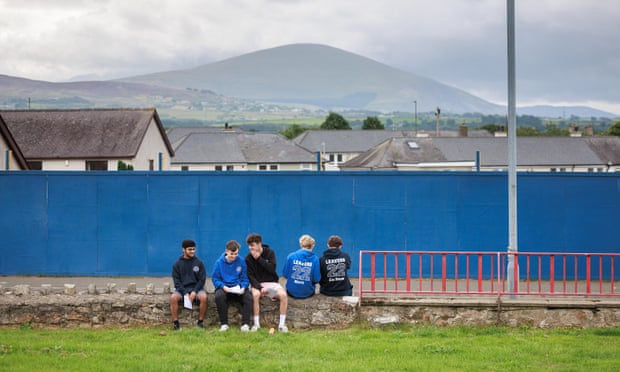 Students at Ysgol Syr Hugh Owen collect their A-level results at their school, 18 August 2022.