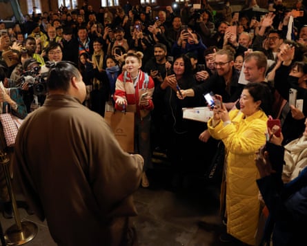 Fans greet sumo star Takayasu Akira as he exits the Royal Albert Hall after the final day of Grand Sumo Tournament in October.