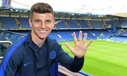 Chelsea's Mason Mount holds up his hand to signify the five-year contract he has just signed