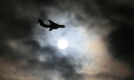 a russian plane flies past the sun during a military exercise