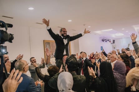 Somar raises a cheer at his wedding.