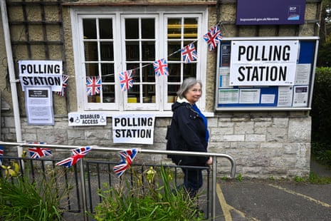 A woman leaving Canford Cliffs library polling station in Poole today.