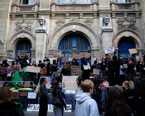 French high school students gather outside the Lycee Voltaire high school as part of nationwide protests in Paris, France.