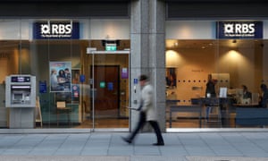 A man walks past a branch of the Royal Bank of Scotland in London