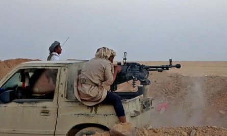 A combatant fires a heavy machine gun