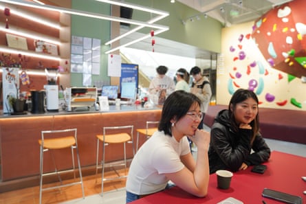 Women sitting at a table with coffee in cafe-style surroundings