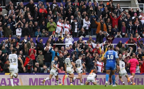 England fans celebrate after Elliott Whitehead scored their side's sixth try.