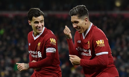 Roberto Firmino, right, celebrates his first and Liverpool’s second with Philippe Coutinho, who scored the opener.