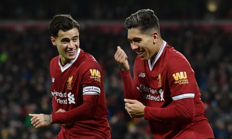 Roberto Firmino celebrates after his first goal put Liverpool 2-0 up against Swansea with Philippe Coutinho