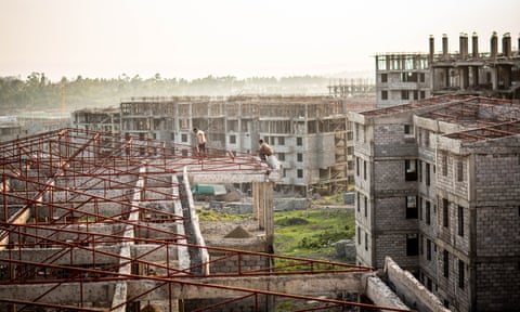 Two construction workers in Koye, the largest condominium site under construction outside Addis Ababa.