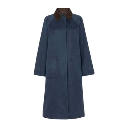 A long navy waxed overcoat on a white background