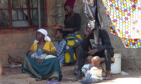A family outside their home in Lusaka, Zambia