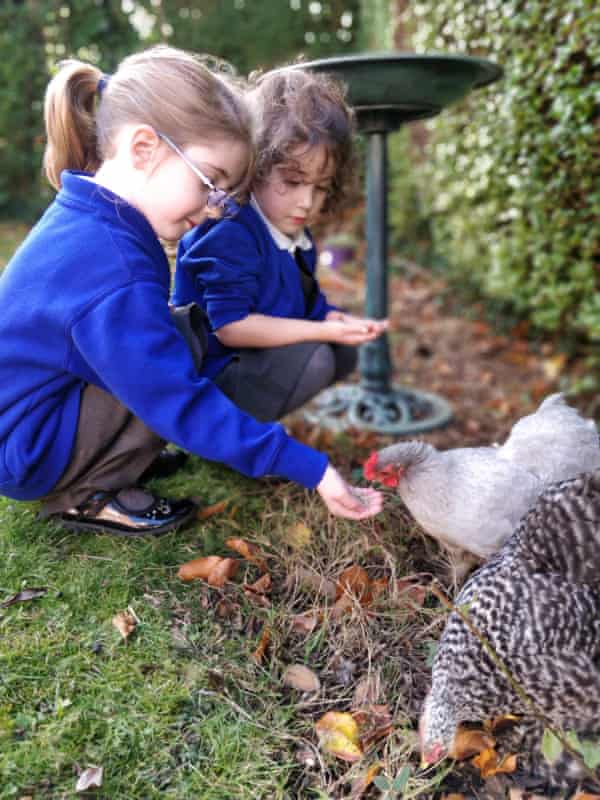Sarah Dove’s daughters with their two bantam hens.