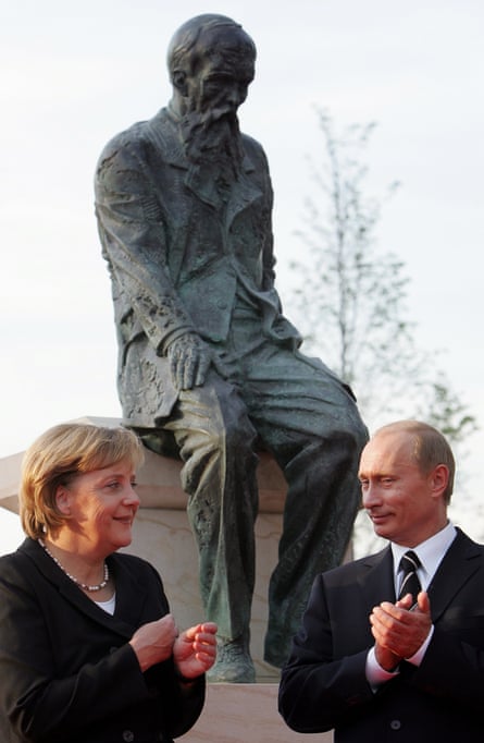 Putin with Angela Merkel at the Dostoyevsky Monument in Dresden, 2006.