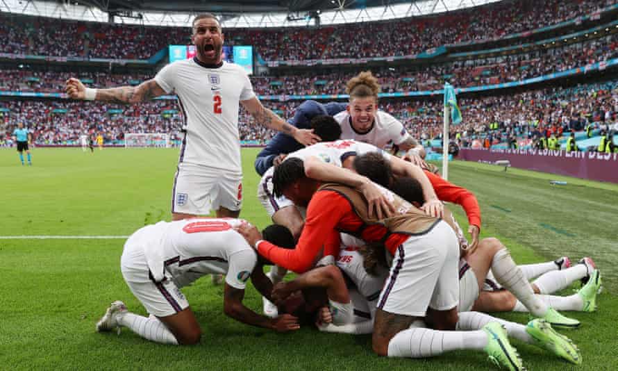 Harry Kane of England celebrates with team mates after scoring their side’s second goal.