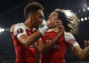 Pierre-Emerick Aubameyang (left) Arsenal celebrates Matteo Guendouzi (right) after his cross is turned off in the net by the BATE Borisov defender Zakhar Volkov.