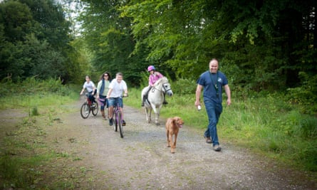 A family walking, cycling and horse-riding in Canaston Woods