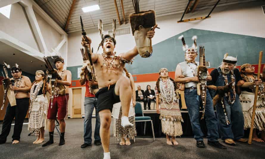 Wiyot brush dancers lead a ceremonial performance after a deed transfer of Indian Island, the site of a massacre.